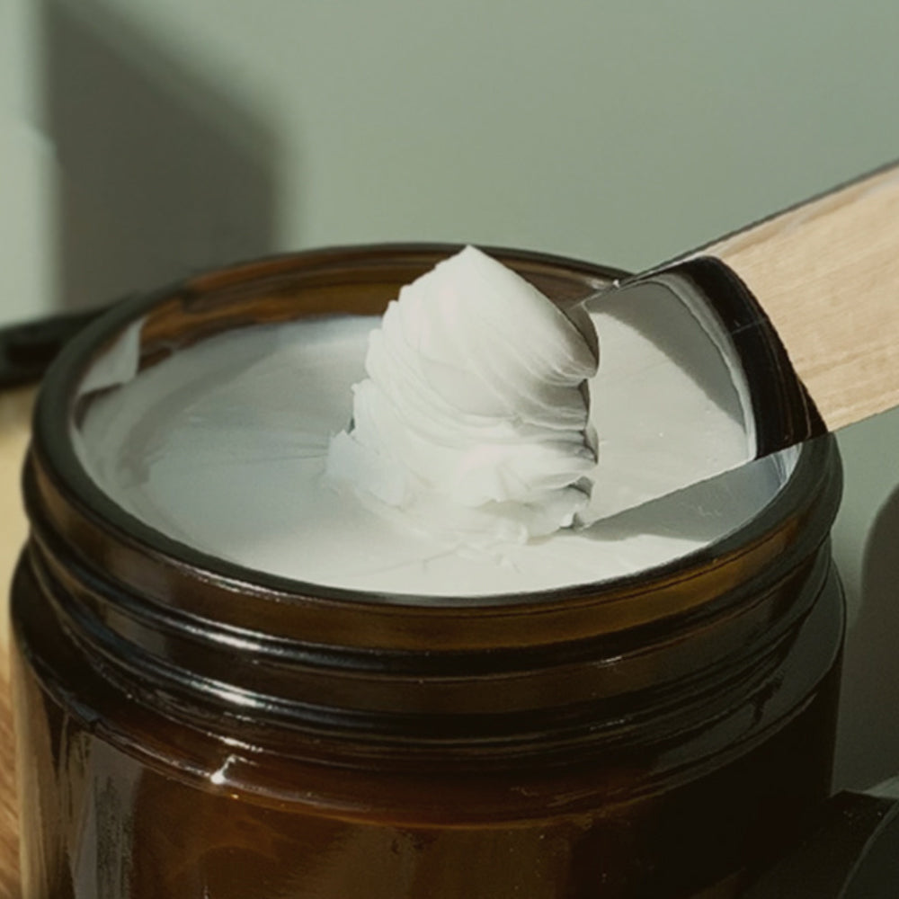 The-Good-Fill refillable nourishing body creme in an 8oz amber jar.