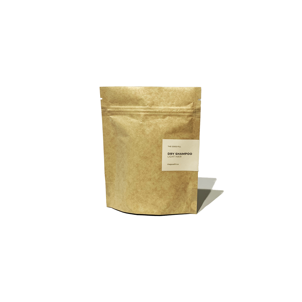 Product image of a 4oz compostable paper packet for zero waste dry shampoo refills.