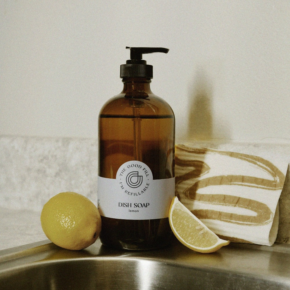 Dish soap refills in a glass amber pump bottle