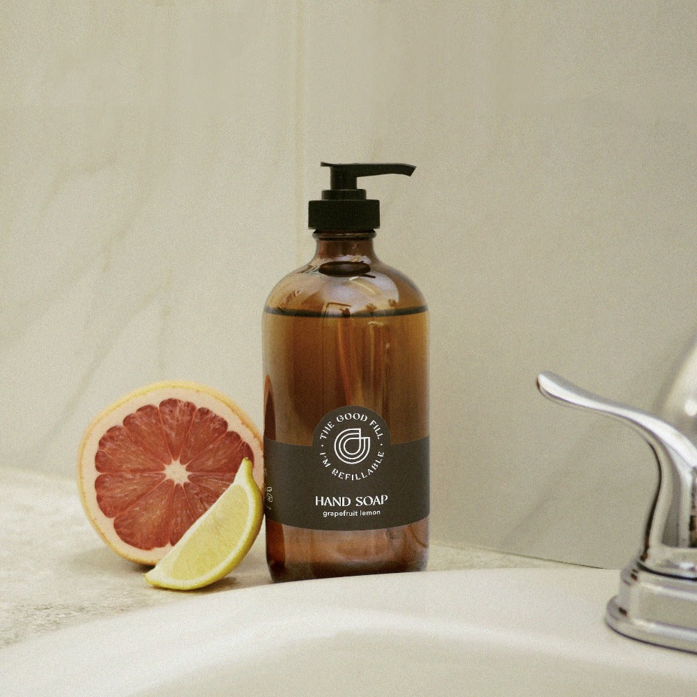 Refillable grapefruit lemon hand soap in a reusable glass amber bottle.