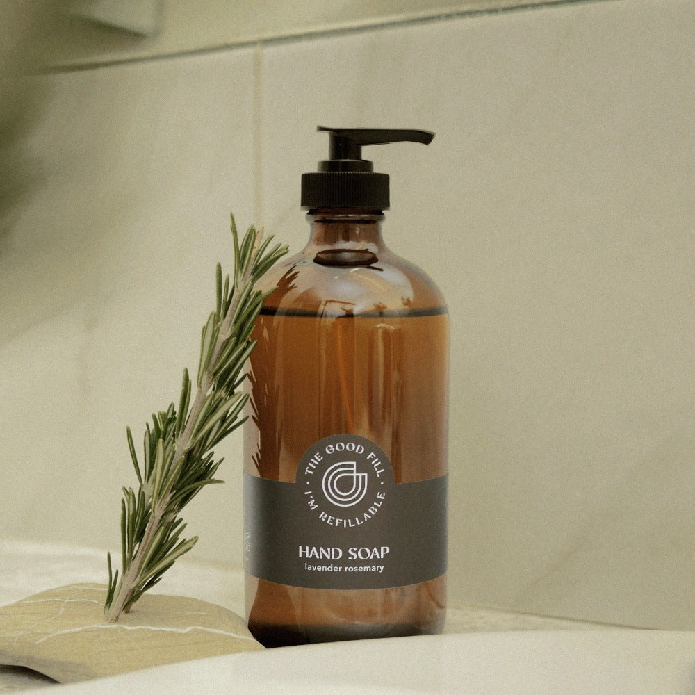 Lavender rosemary hand soap refills in a glass amber bottle.