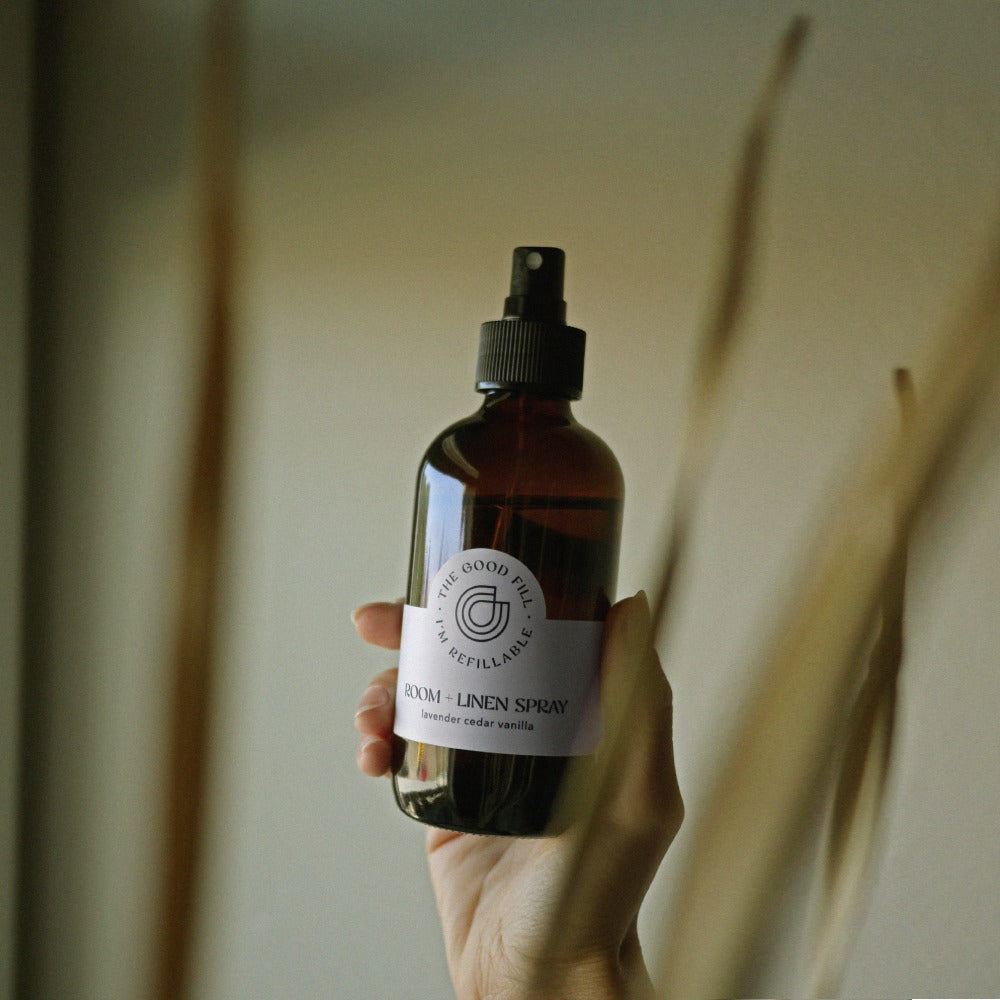 room spray refills in a refillable glass amber bottle