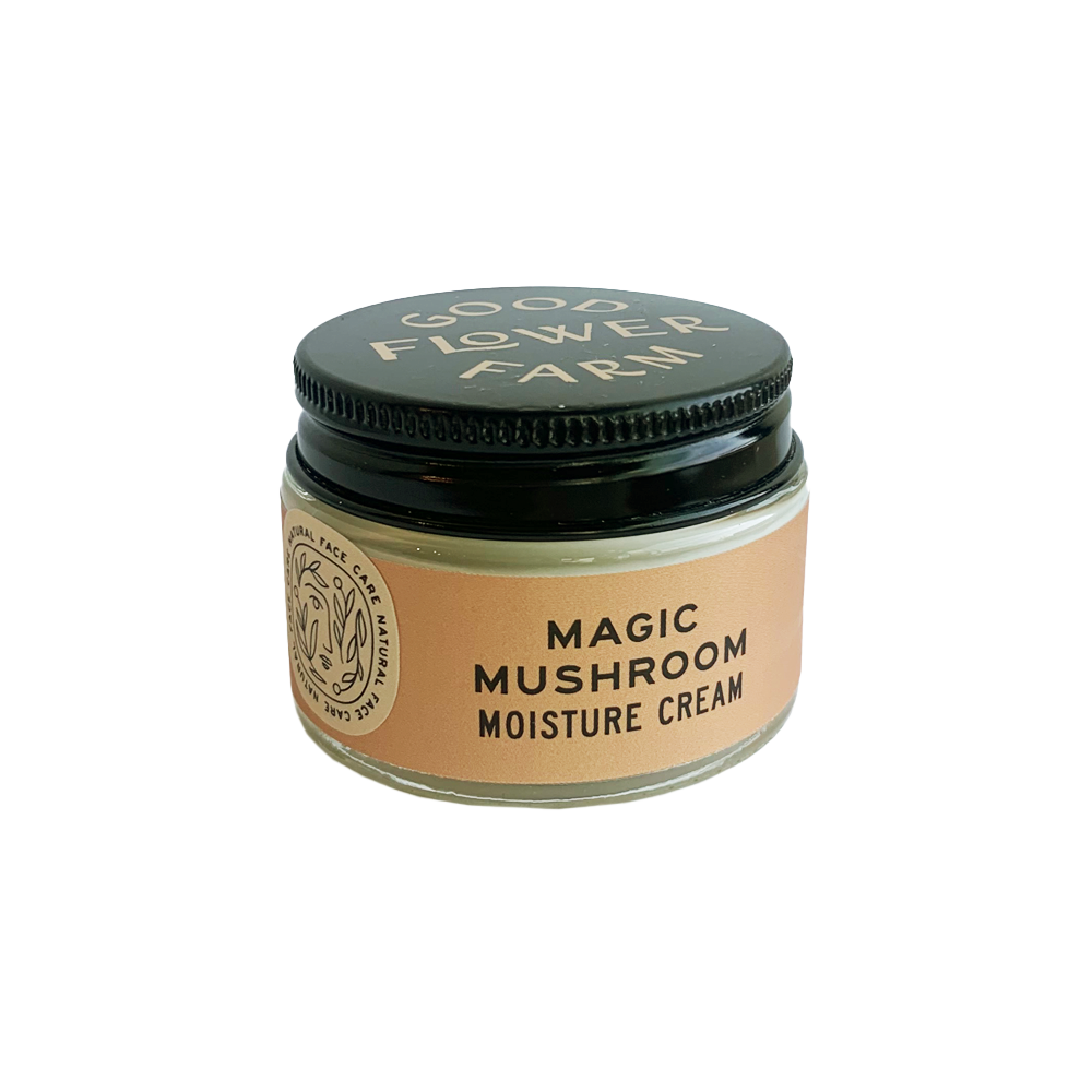 All natural Magic mushroom moisture cream in a small glass jar with a black lid.