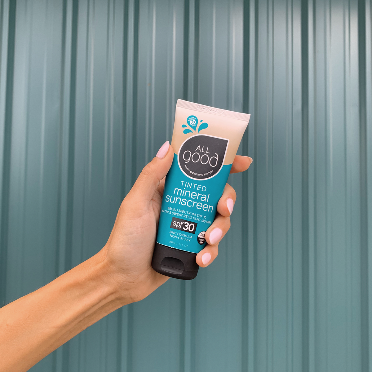 non-toxic tinted mineral sunscreen in a recycled plastic squeeze tube