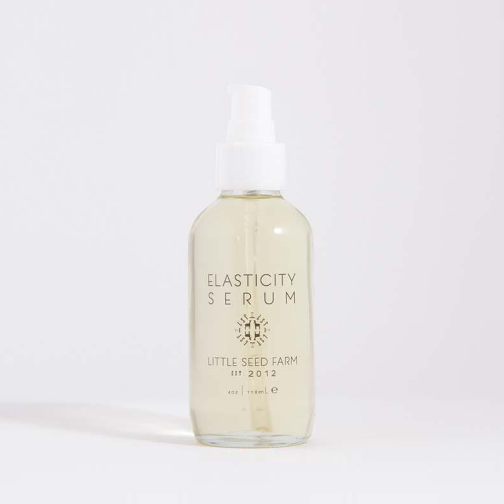 4oz. clear glass bottle of elasticity serum with a white pump top.