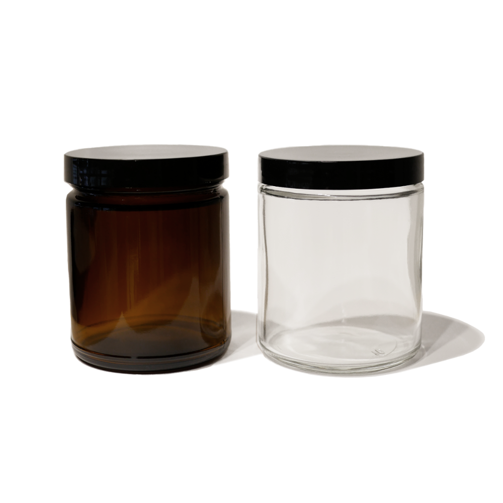 One 8oz amber glass jar with black lid and one 8oz clear glass jar with black lid.