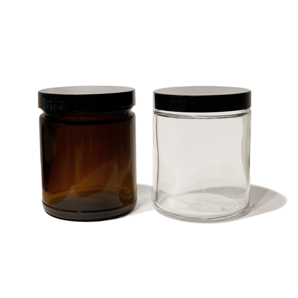 One 8oz amber glass jar with black lid and one 8oz clear glass jar with black lid.
