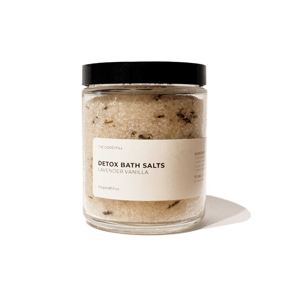 Product image of an 8oz. re-usable clear Good Fill glass jar filled with lavender vanilla Detox Bath Salts. The lid is a black twist-on lid.