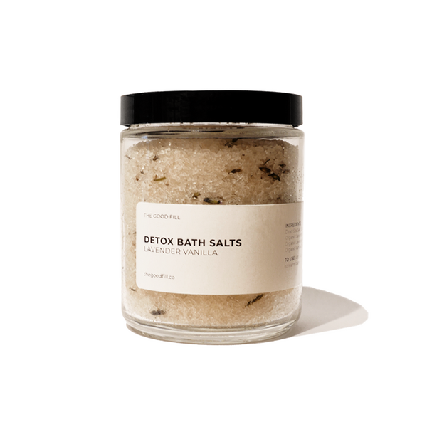 Product image of an 8oz. re-usable clear Good Fill glass jar filled with lavender vanilla Detox Bath Salts. The lid is a black twist-on lid.