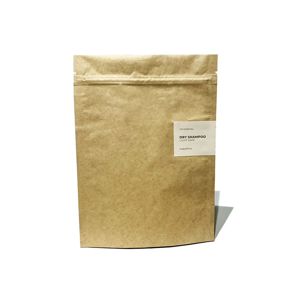 Product image of an 8oz compostable paper packet for zero waste dry shampoo refills.