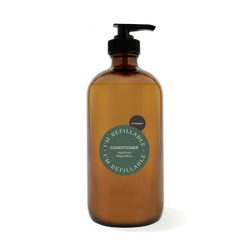 16oz glass amber bottle with a black pump top for zero waste peppermint conditioner refills.