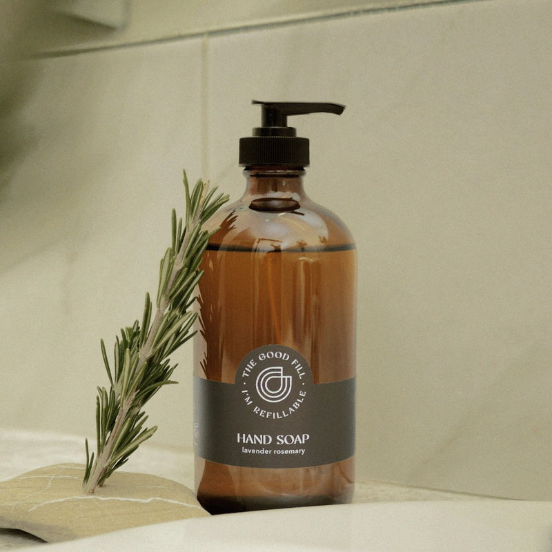 Lavender rosemary hand soap refills in a glass amber bottle