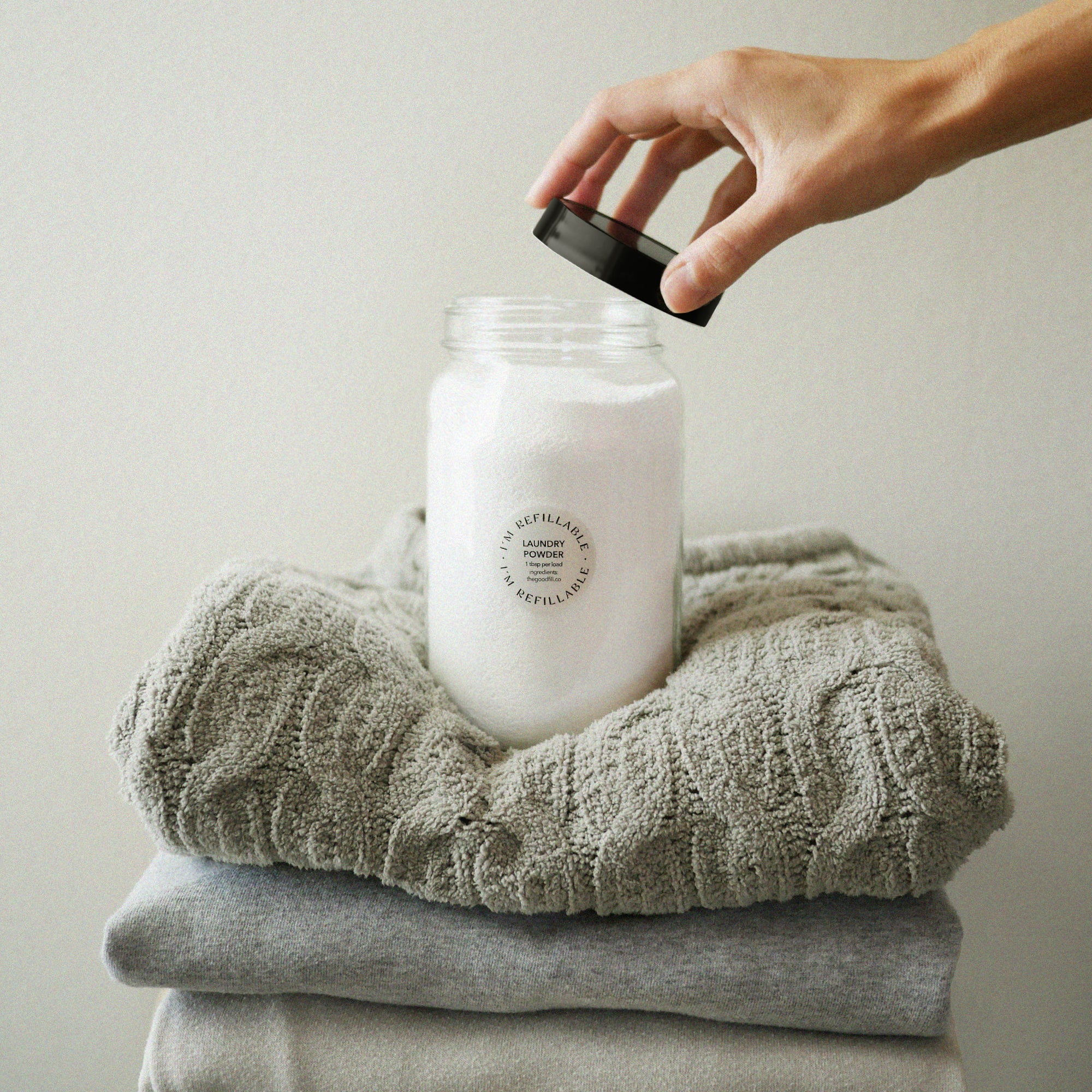 refillable laundry powder in a glass jar.