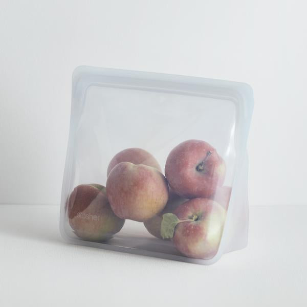 clear stasher stand up bag with apples inside.