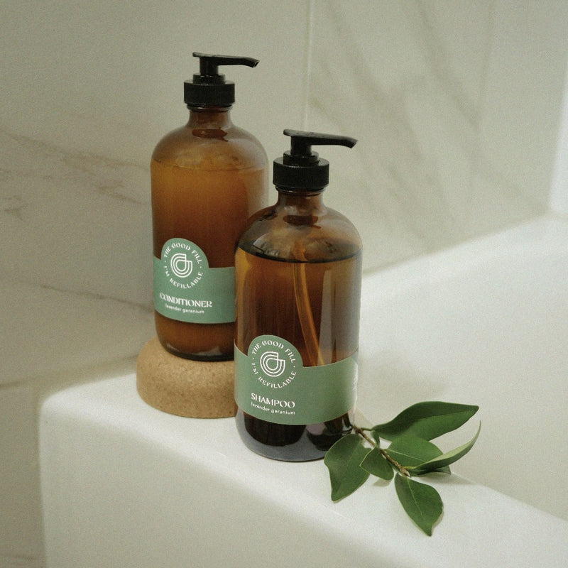 Shampoo and conditioner refills in a zero waste glass amber bottle