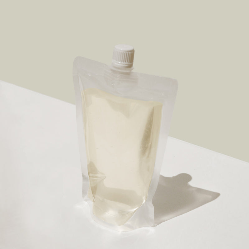 Leave-In Conditioner refills in a clear reusable pouch