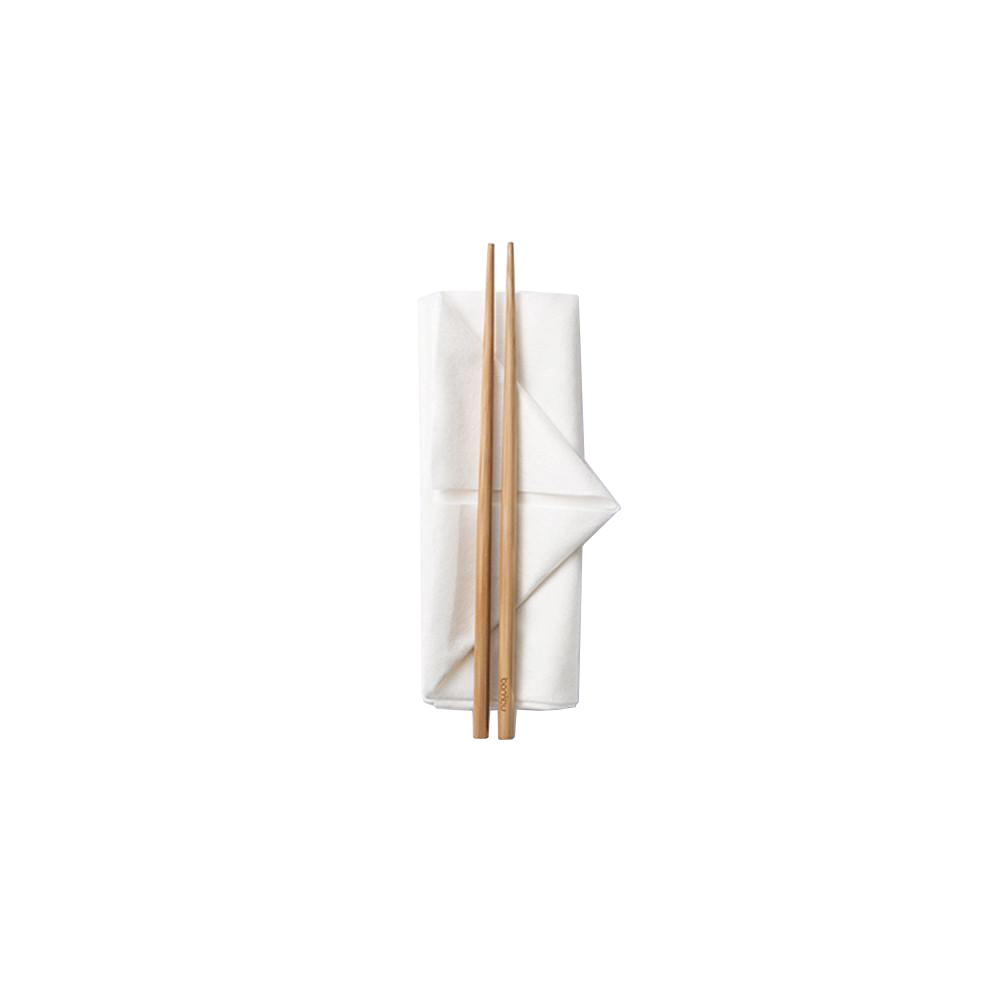 a pair of reusable natural brown bamboo chopsticks sitting on a neatly folded white napkin.