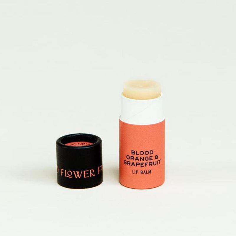All natural Blood Orange & Grapefruit lip balm in a 0.25 oz eco-friendly biodegradable cardboard tube