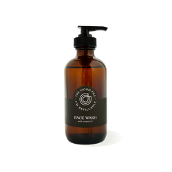  8oz glass amber bottle with a black pump top for zero waste face wash refills.