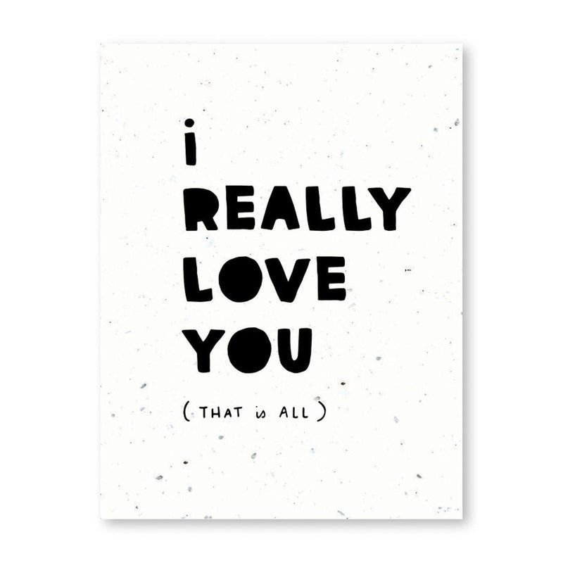 a white card with black print that says "i really love you (that is all)"