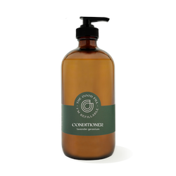 16oz glass amber bottle with a black pump top for zero waste lavender geranium conditioner refills.