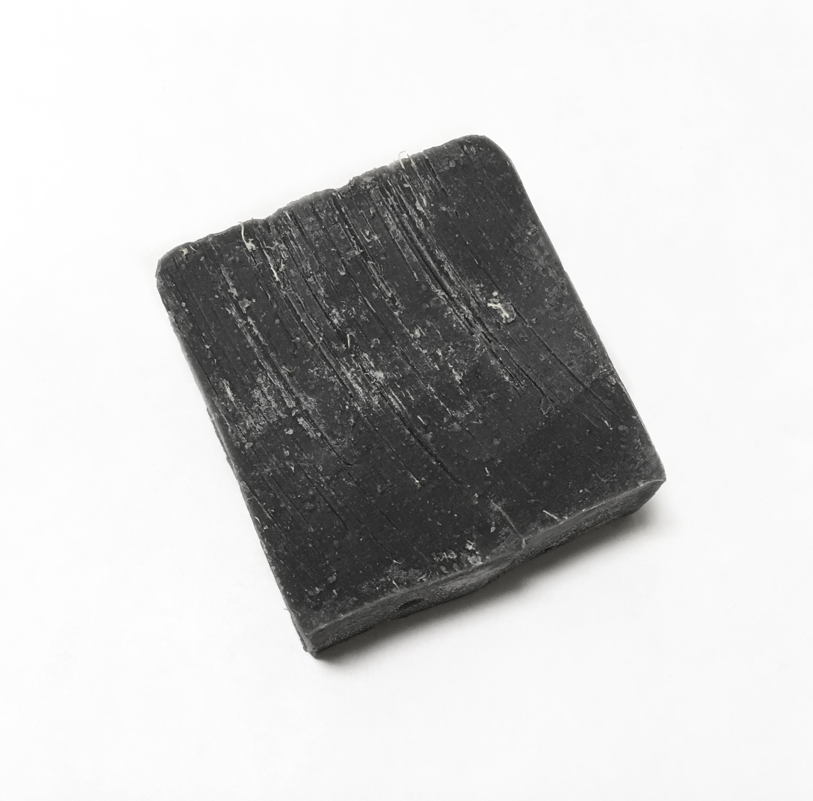 up close image of the zero waste charcoal colored underarm detox bar.