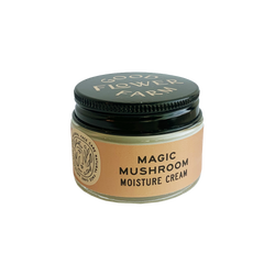 All natural Magic mushroom moisture cream in a small glass jar with a black lid.