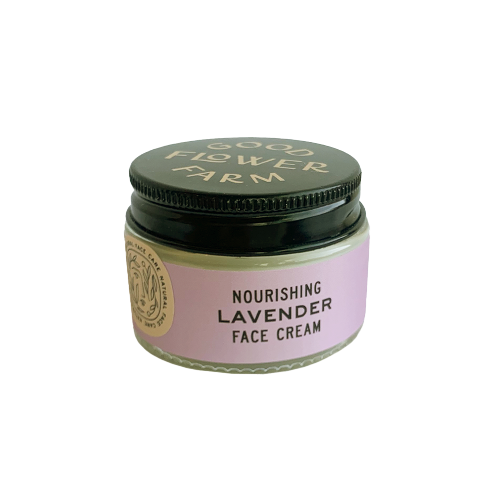 moisturizing lavender face cream in a 1oz. glass jar and a black plastic lid.