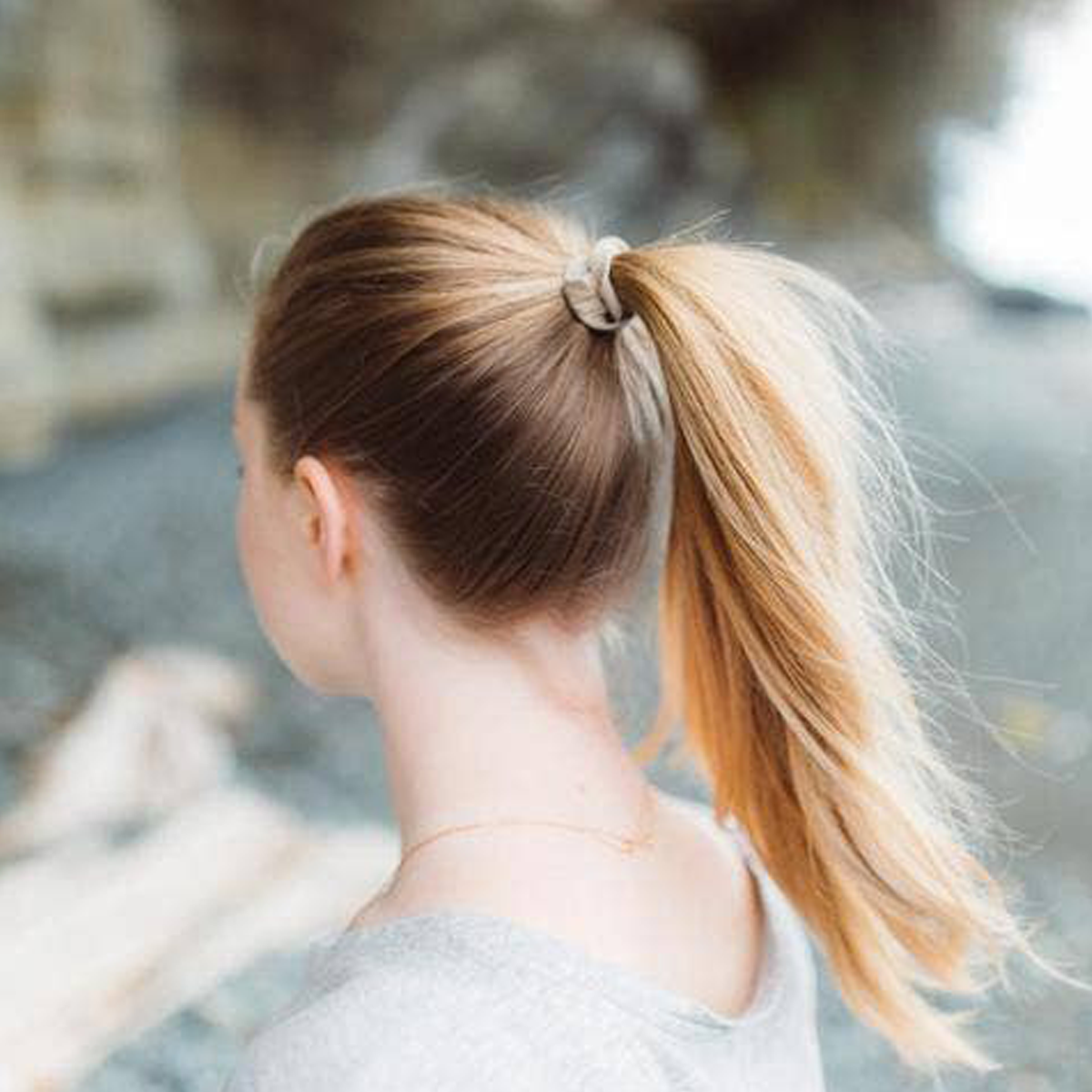 a girl with a pony tail using a plastic free hair tie.