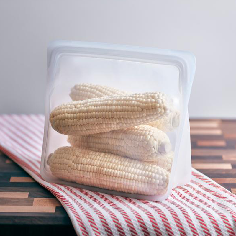 clear stasher stand up bag with corn inside.