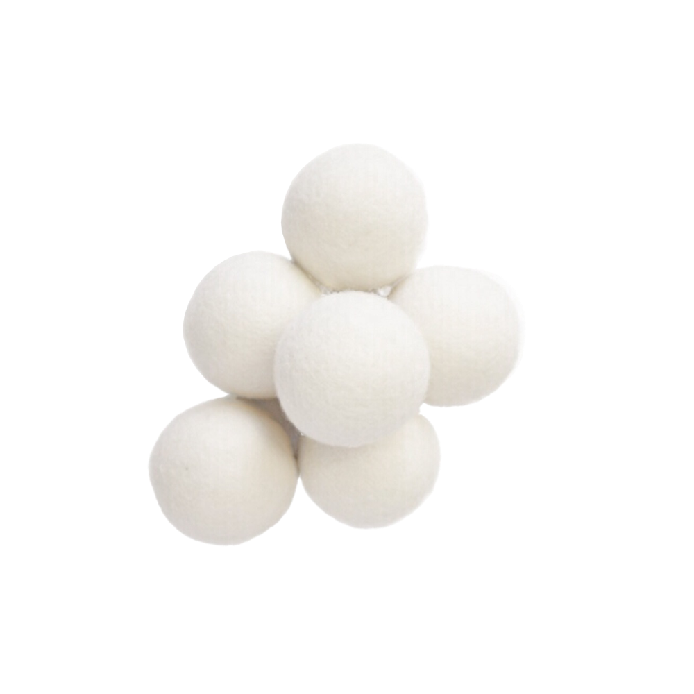 a pile of six zero waste, package free, white wool dryer balls
